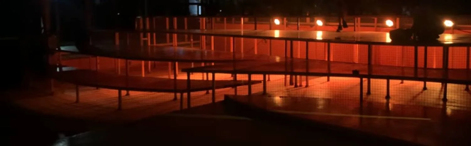 Outdoor venue under orange light at night