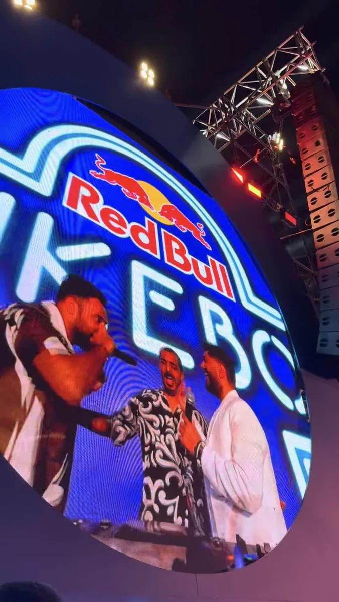 Screen close-up of performers on stage